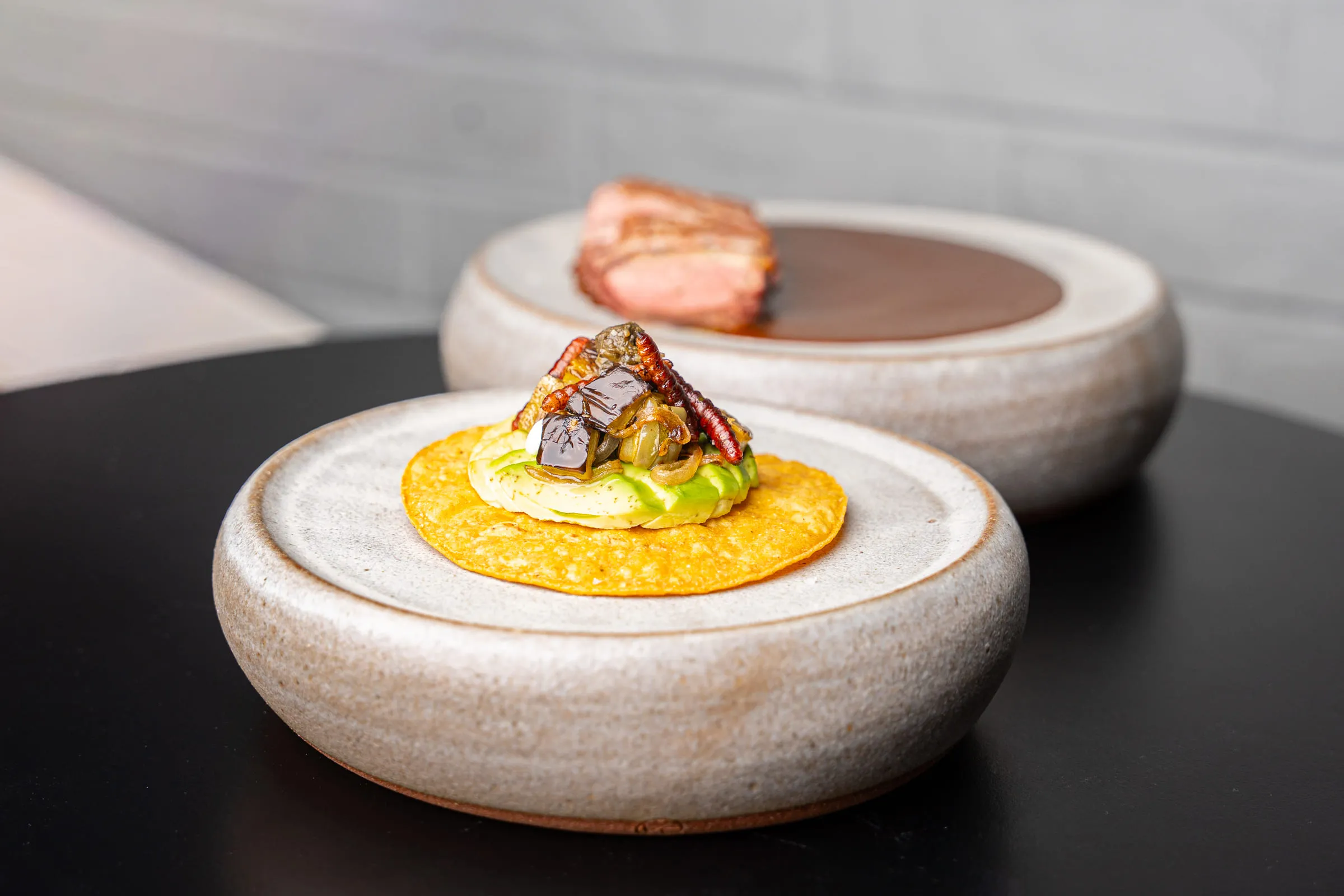 Stoneware service with pork belly — Food photography by JP Media Groups