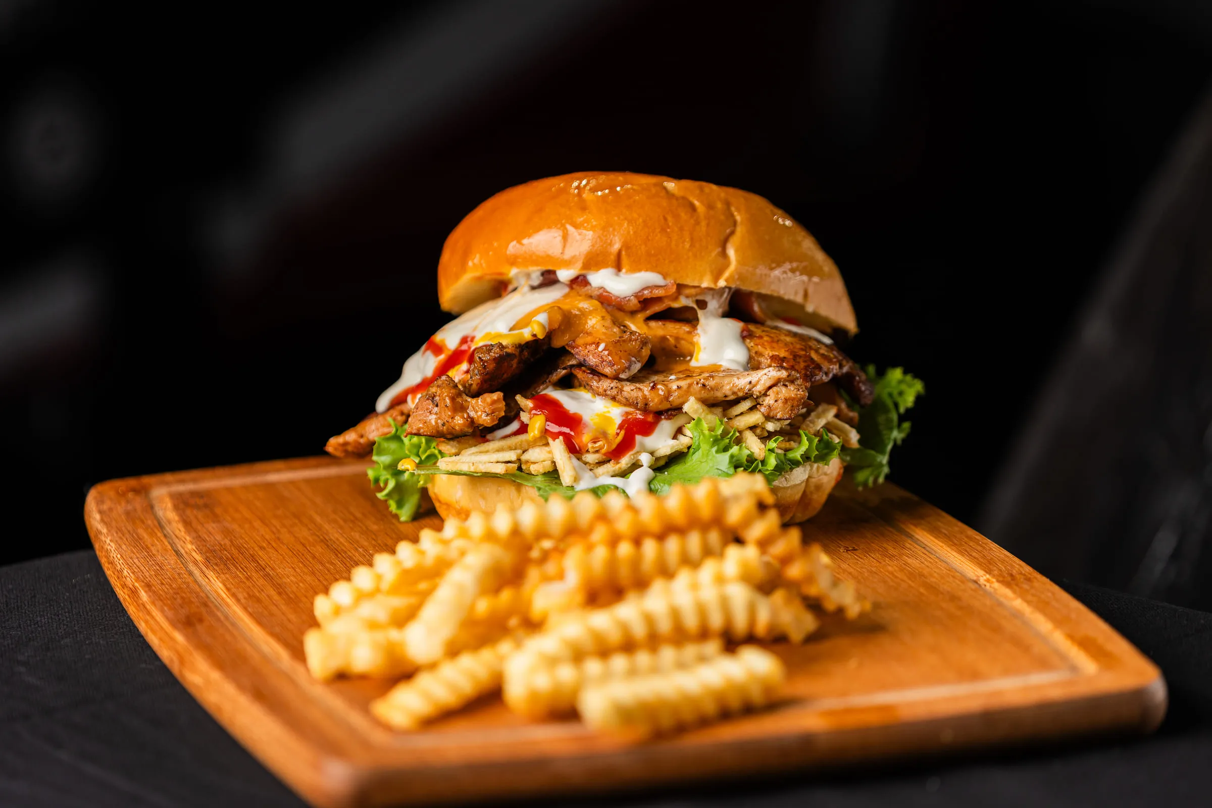 Chicken burger with crinkle fries — Food photography by JP Media Groups